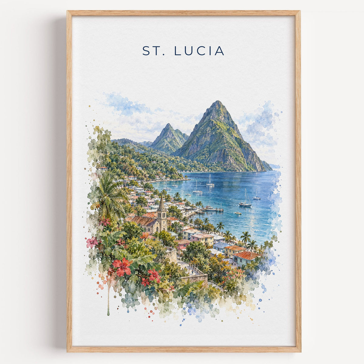 Saint Lucia Pitons watercolor print in a light oak frame on a plain white wall