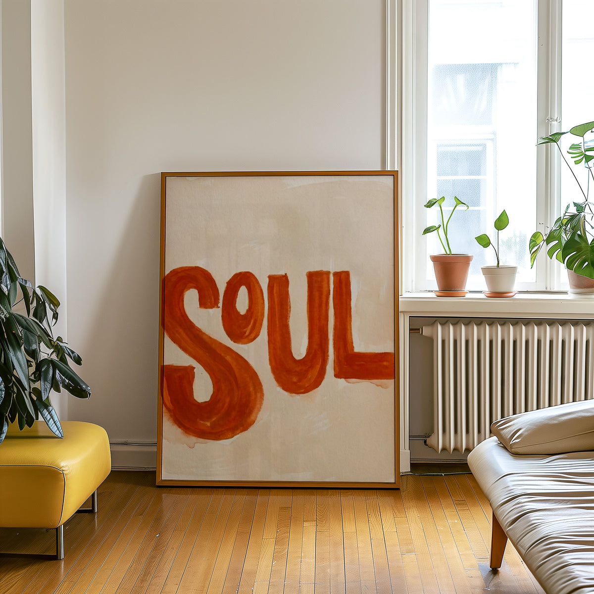 Retro music typography print in an oak frame leaning beside a yellow leather bench