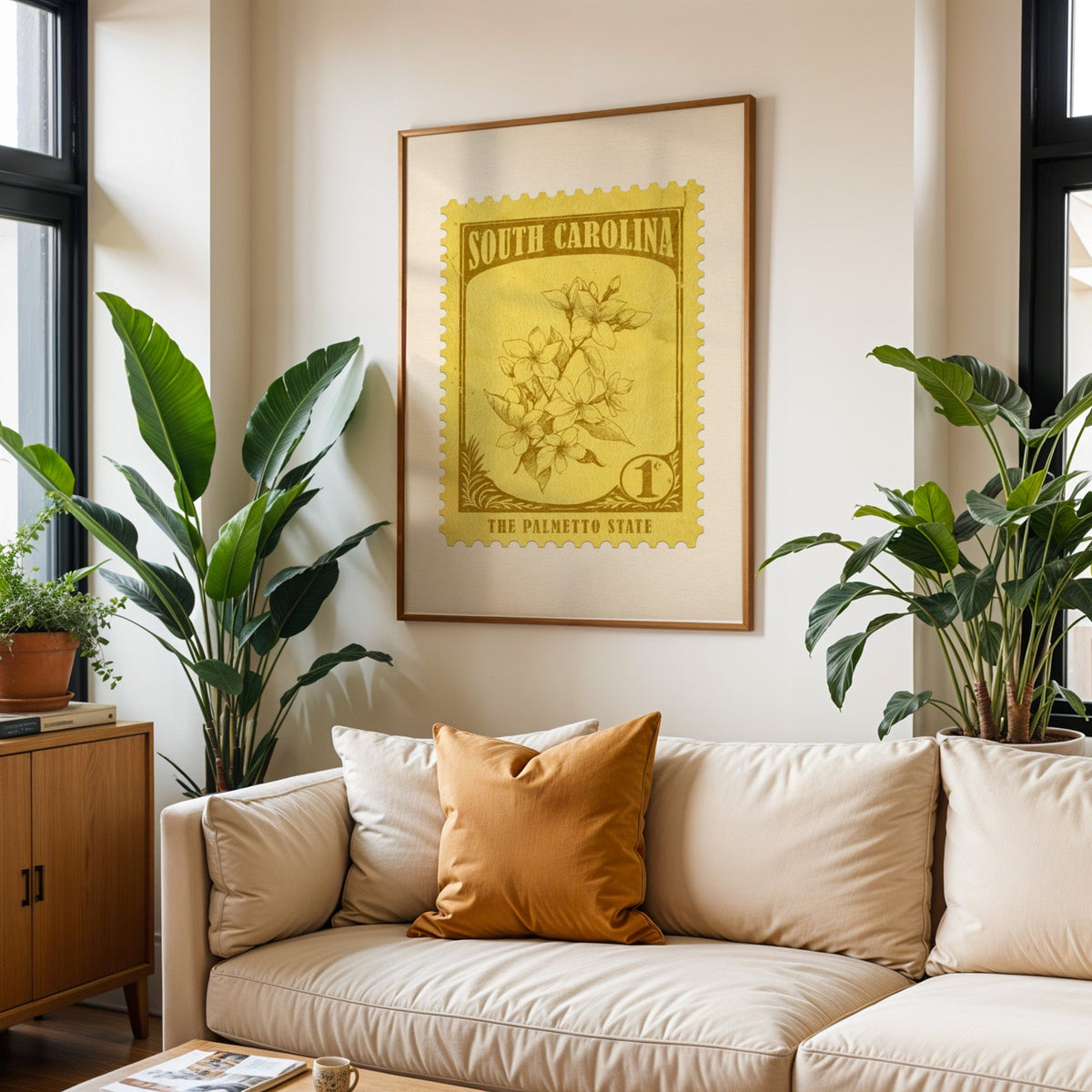 South Carolina state flower print framed above a cream sofa with an ochre cushion and large plants