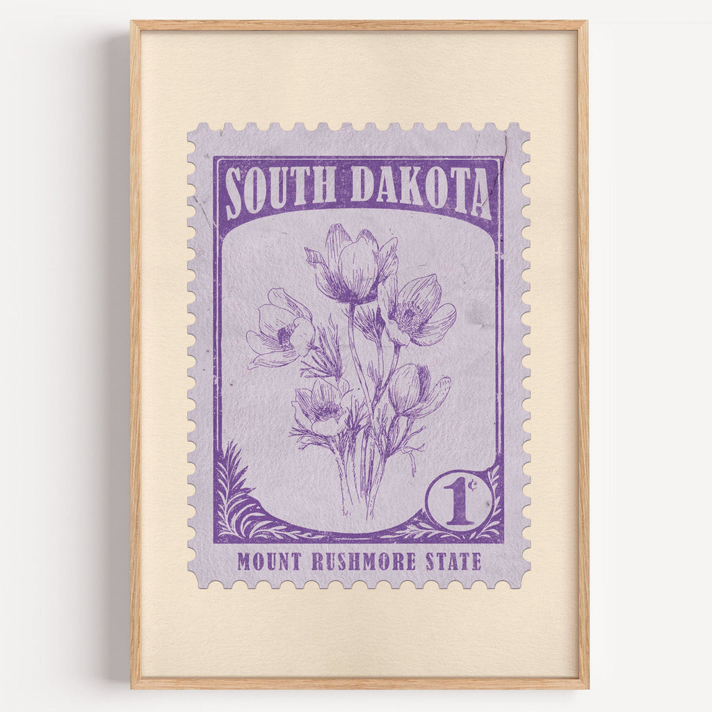 South Dakota state flower stamp print in violet purple on lilac, light oak frame on a white wall