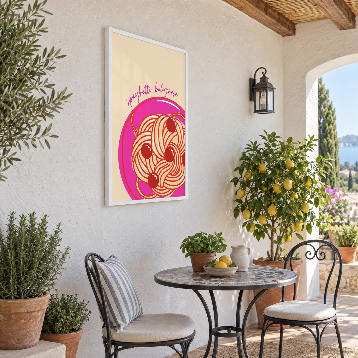 Spaghetti bolognese pink plate print in a white frame on a sunny patio wall beside a potted lemon tree