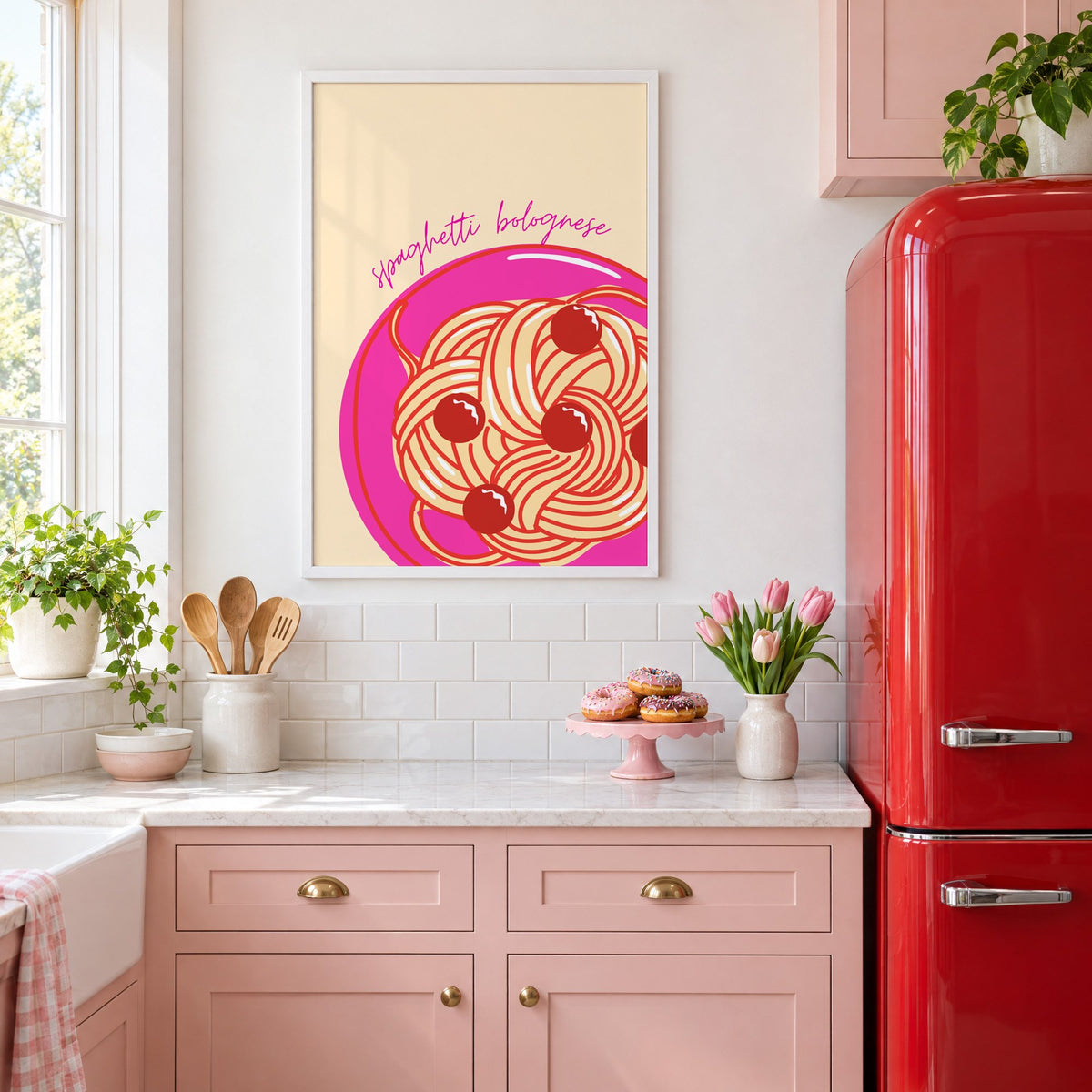 Spaghetti bolognese pink plate print in a white frame in a pink kitchen beside a red retro fridge