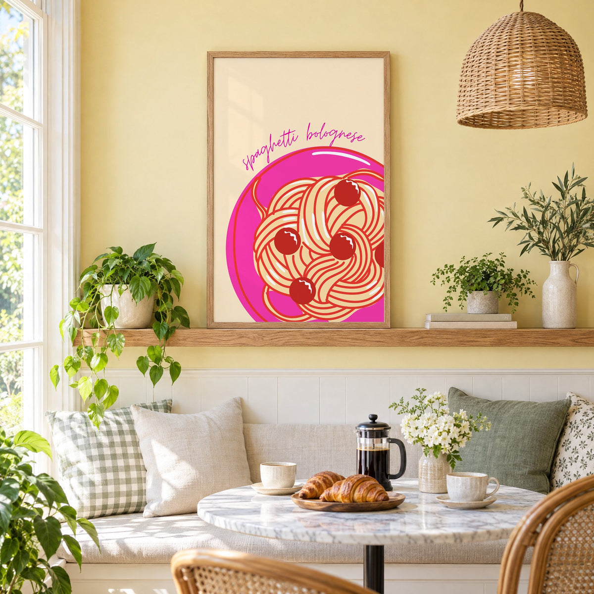 Spaghetti bolognese pink plate print in an oak frame on a picture ledge above a sunny breakfast nook