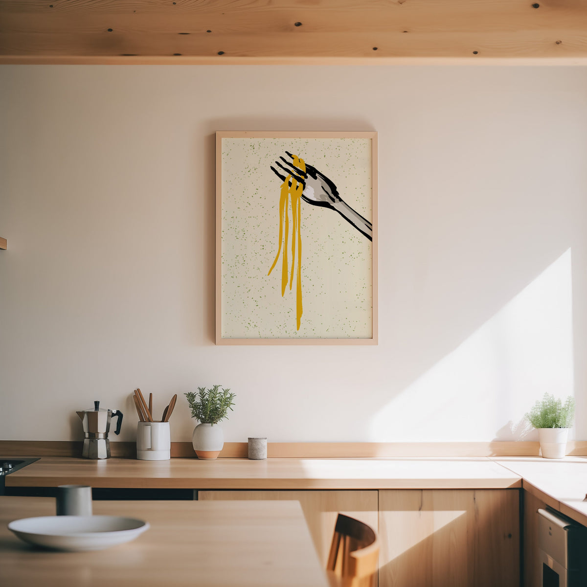 Spaghetti fork print in an oak frame above a wood counter with a moka pot and herbs
