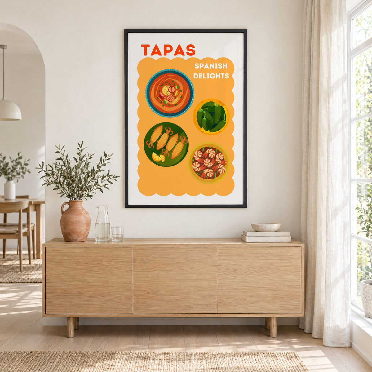 Spanish tapas four plates print in a black frame above an oak sideboard with a terracotta vase of olive branches