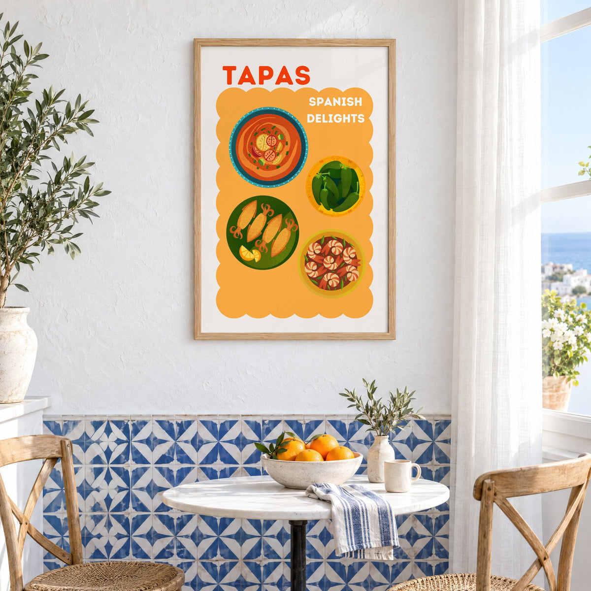 Spanish tapas four plates print in an oak frame above a bistro table and blue patterned tiles
