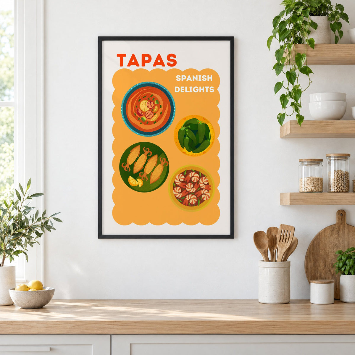 Spanish tapas four plates print in a black frame in a white kitchen beside open wood shelves and glass jars
