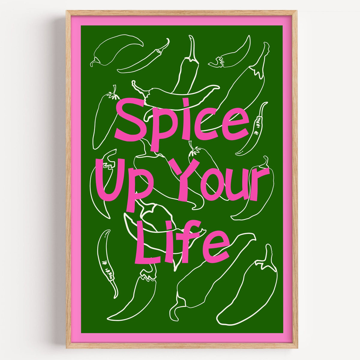 Spice Up Your Life green chilli print in a light oak frame on a plain white wall