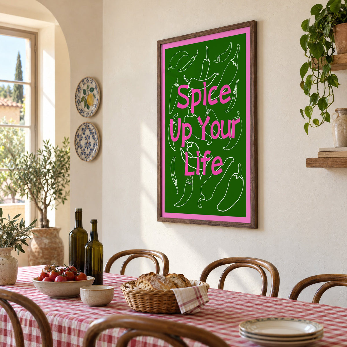 Spice Up Your Life green chilli print in a walnut frame above a gingham-covered trattoria table, seen at an angle