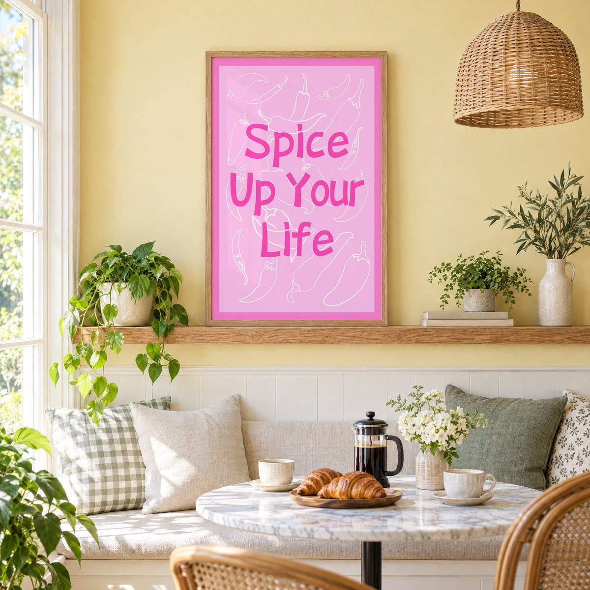 Spice Up Your Life pink chilli print in an oak frame on a picture ledge above a sunny breakfast nook