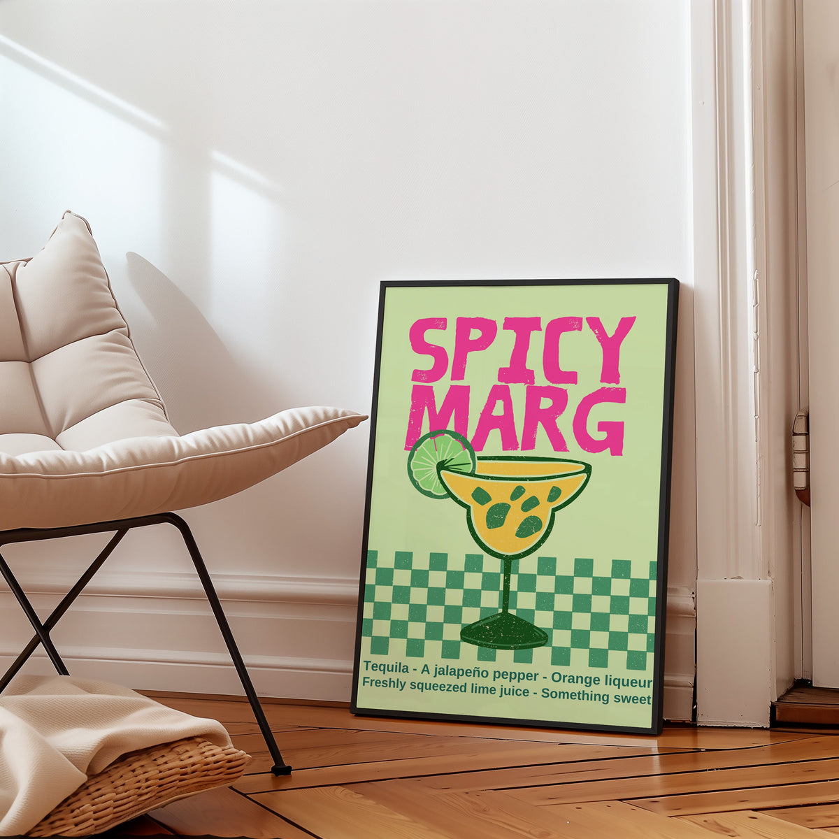 Spicy Marg jalapeno margarita print in a slim black frame leaning on a herringbone floor beside a cream armchair