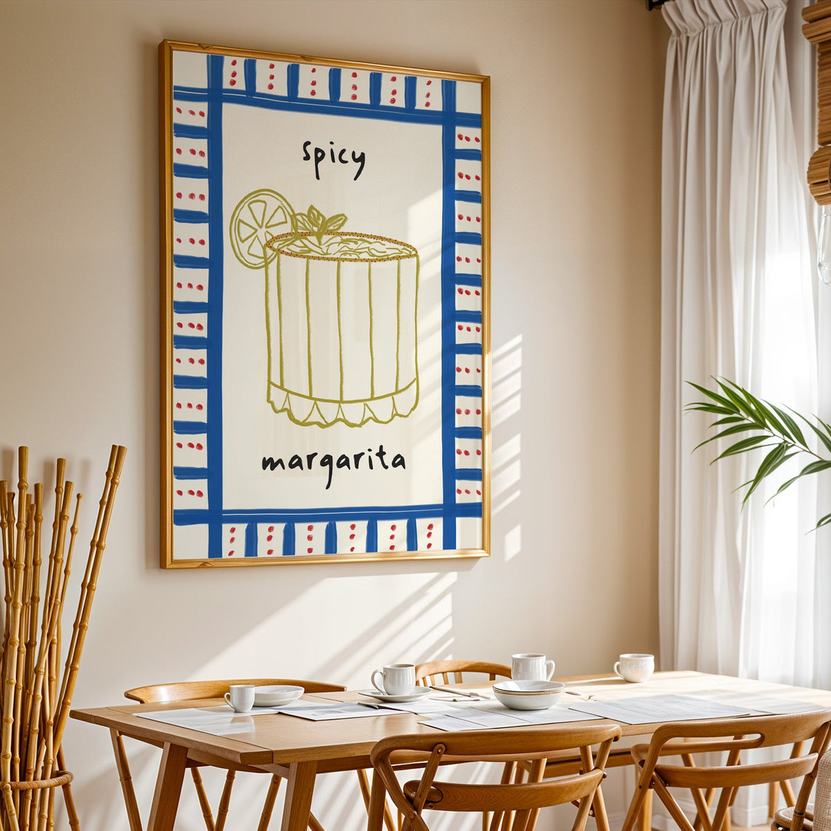 Spicy margarita gingham print in a gold frame above a sunlit breakfast table