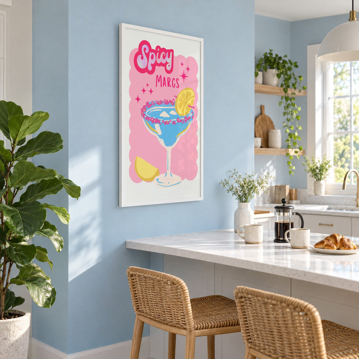 Spicy Margs blue margarita print in a white frame on a pale blue wall above a breakfast bar with rattan stools