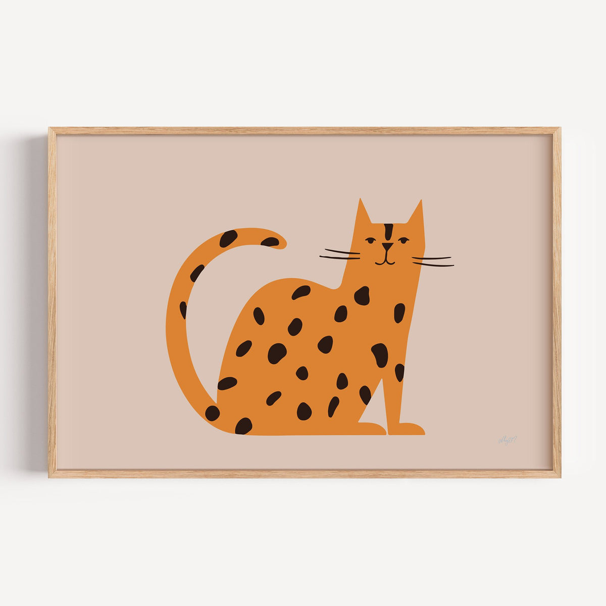 Minimal orange spotted cat nursery print in a light oak frame on a plain white wall