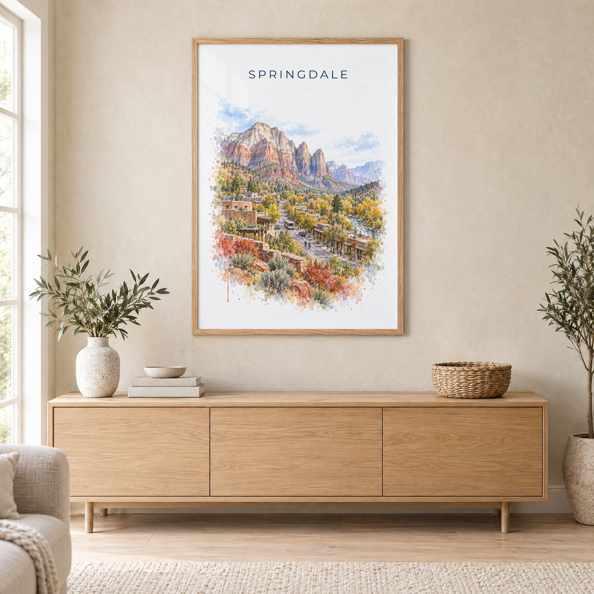 Springdale, Utah watercolor print in an oak frame above a light wood sideboard in a Scandinavian living room
