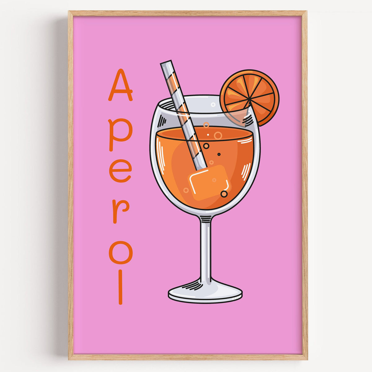 Orange spritz glass on pink print in a light oak frame on a plain white wall