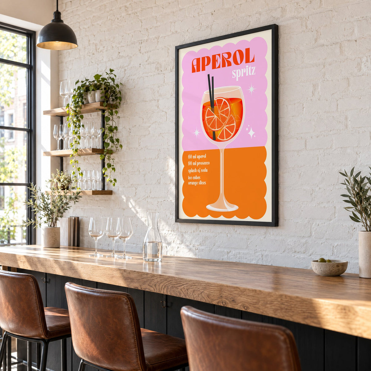 Spritz recipe pink and orange print in a black frame on a white brick wall above a wine bar counter