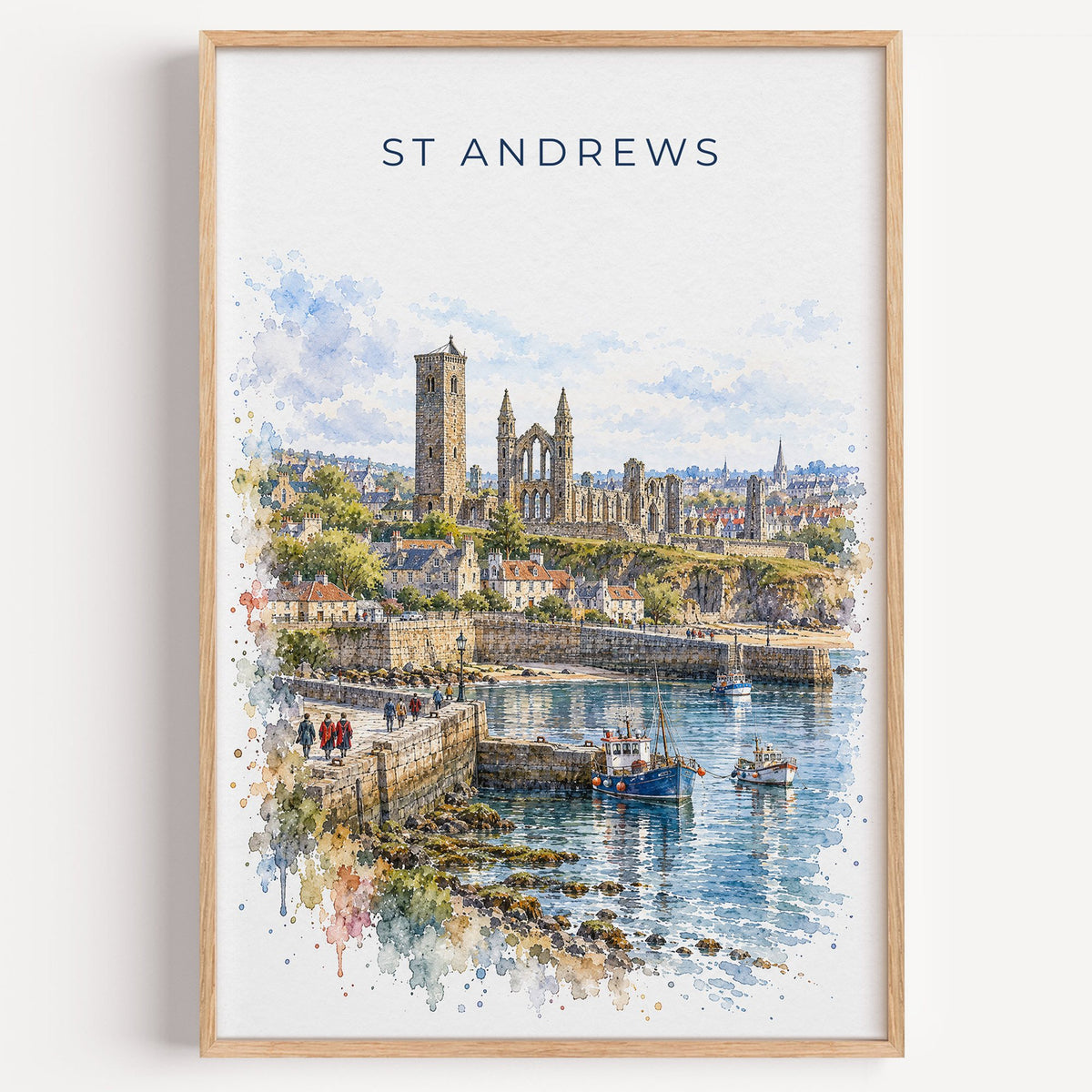 St Andrews watercolor print in a light oak frame on a plain white wall