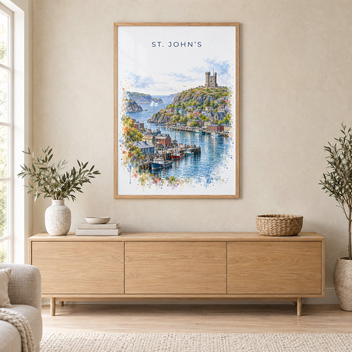 St. John's watercolor print in an oak frame above a light wood sideboard in a Scandinavian living room