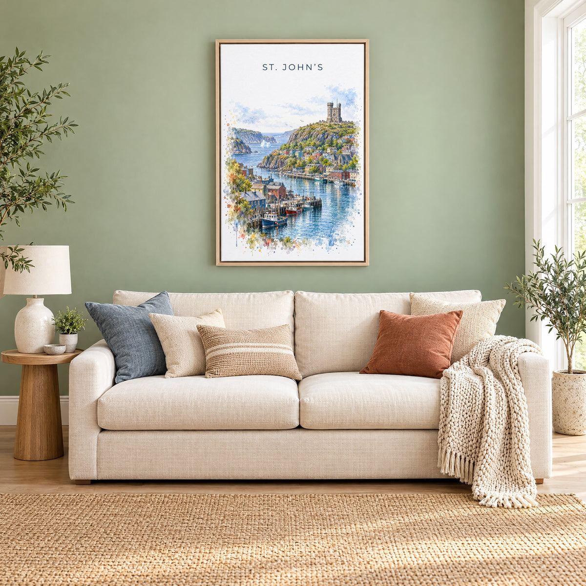 St. John's watercolor print as a natural floater canvas above a cream linen sofa on a sage green wall