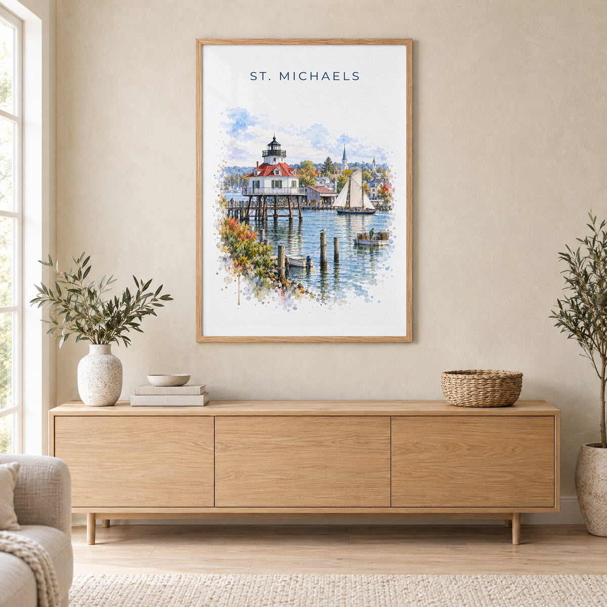 St. Michaels, Maryland watercolor print in an oak frame above a light wood sideboard in a Scandinavian living room