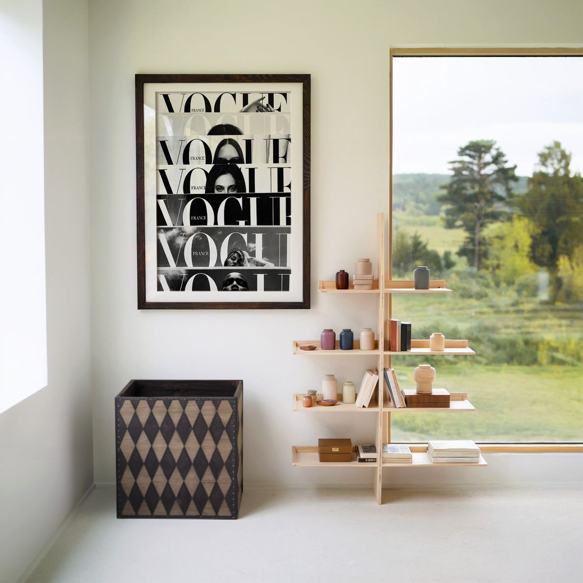 Seven cropped magazine cover strips with face print in a walnut frame with a white mat beside wooden shelves and a garden window