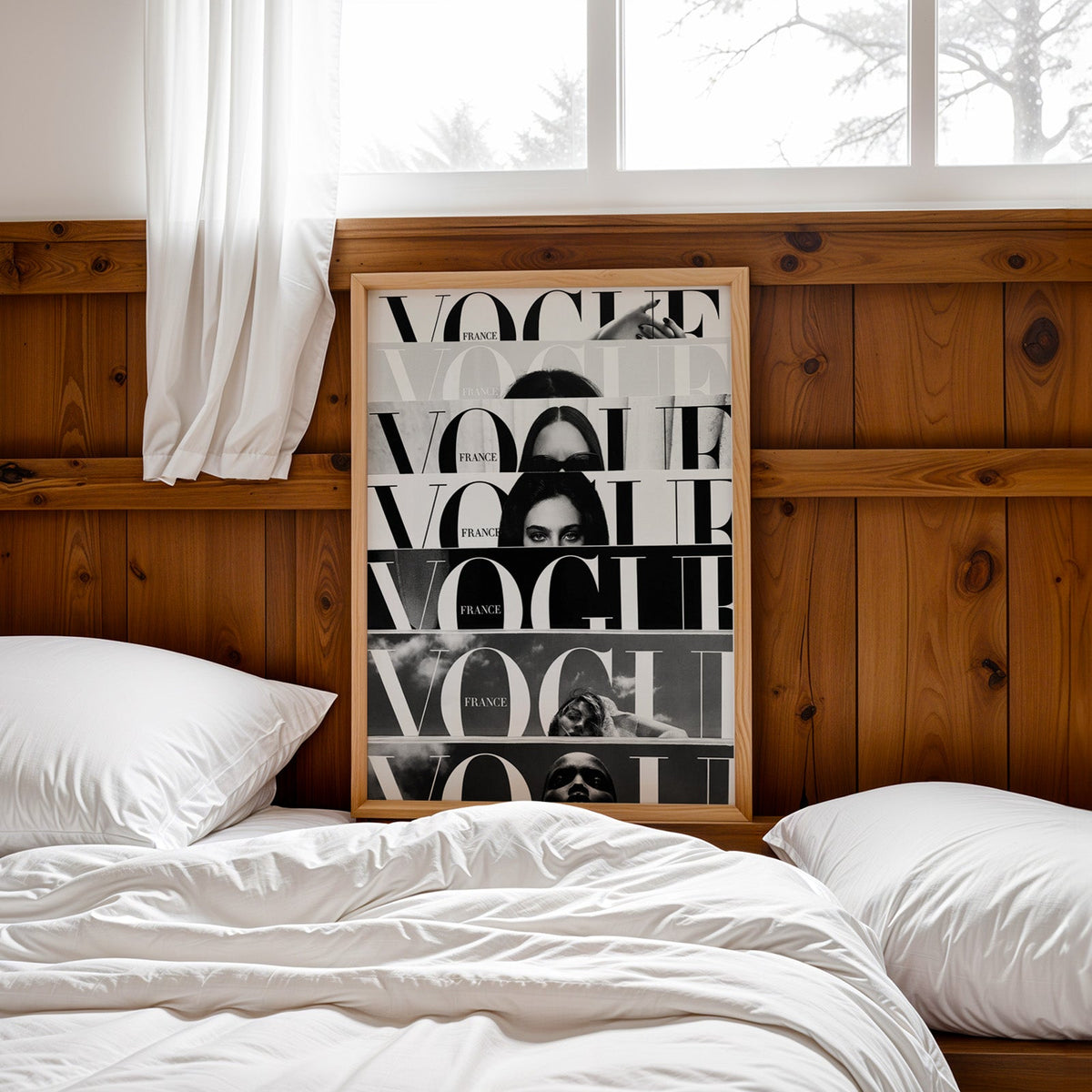 Seven cropped magazine cover strips with face print in a pine frame leaning on a wood headboard over white bedding