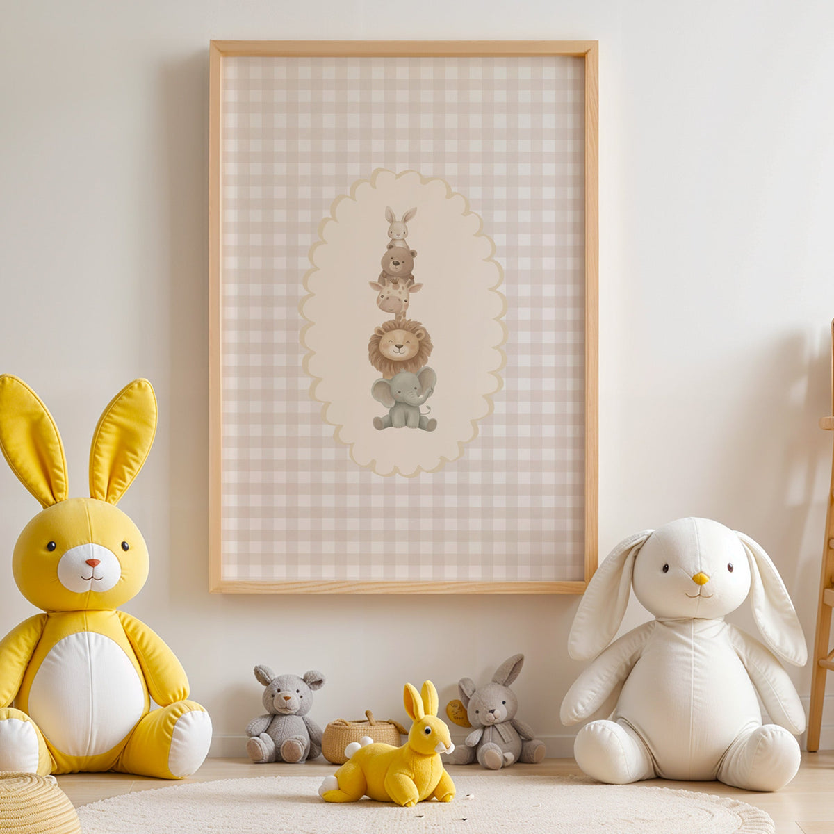 Stacked baby animals in oval on gingham nursery print in an oak frame above yellow and white plush bunnies