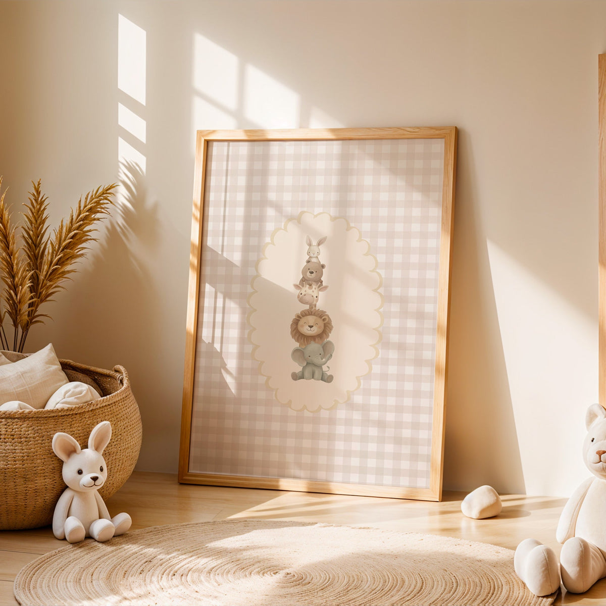 Stacked baby animals in oval on gingham nursery print in an oak frame leaning on a sunlit floor by a woven basket