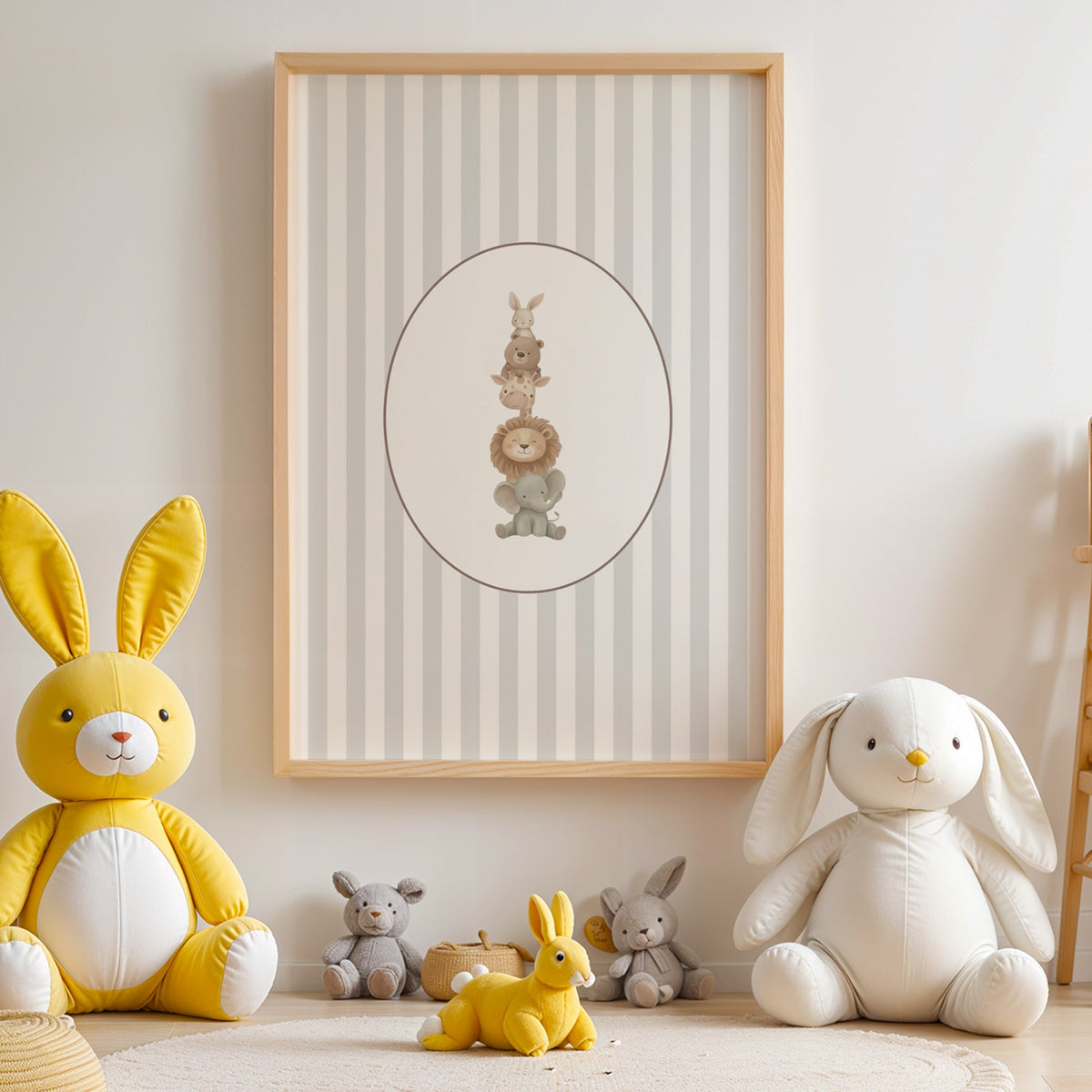 Stacked safari animals on grey stripes nursery print in an oak frame above yellow and white plush bunnies