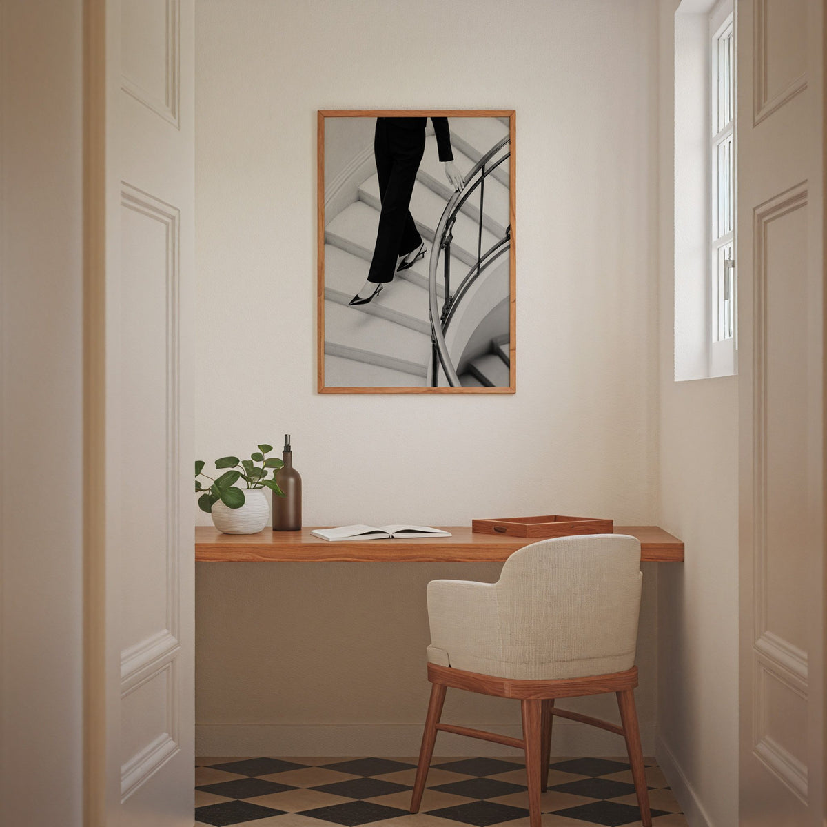 Black trousers and slingback heels on curved stairs print in an oak frame above a home office desk nook