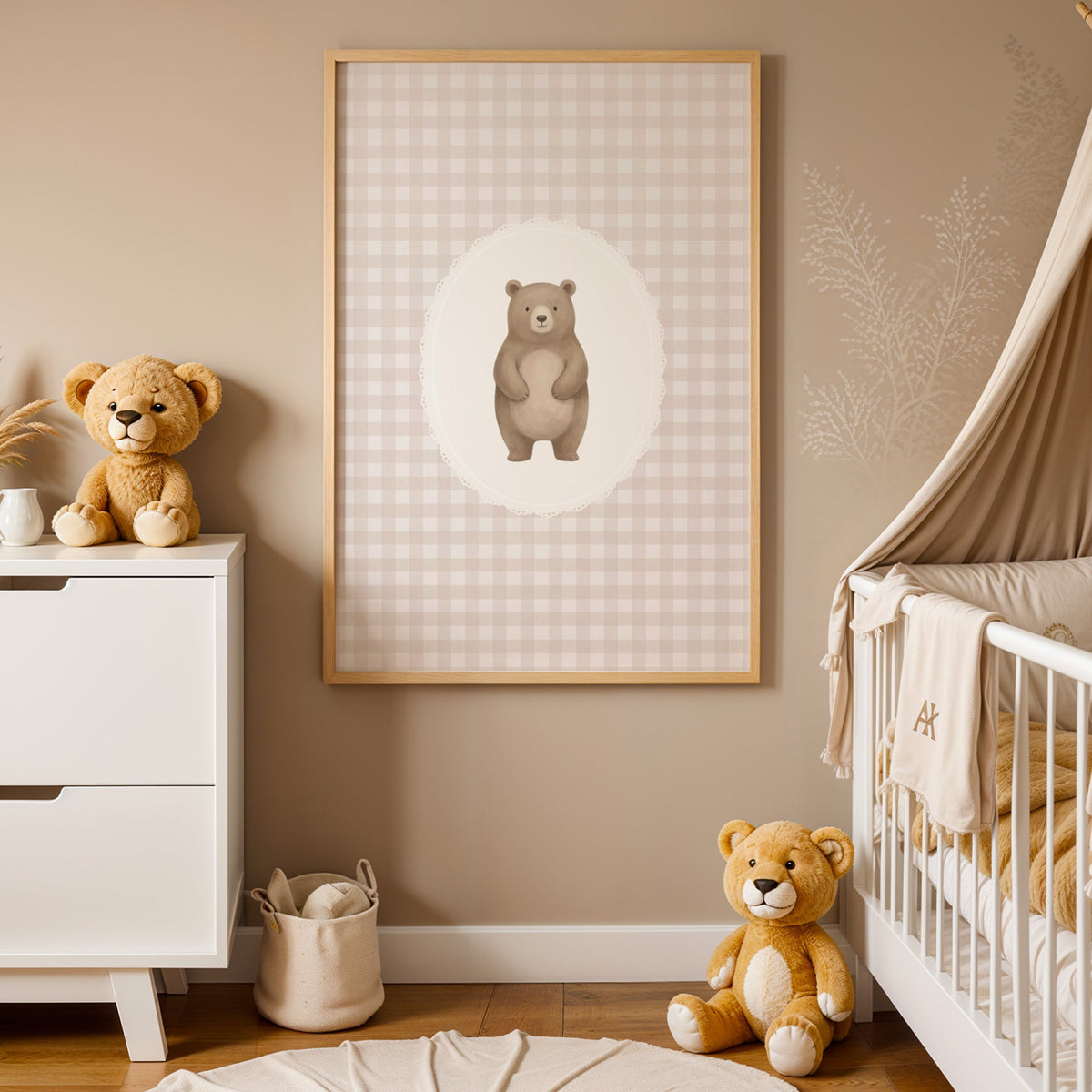 Standing bear in a lace oval on beige gingham nursery print in an oak frame between a white dresser and a canopy crib