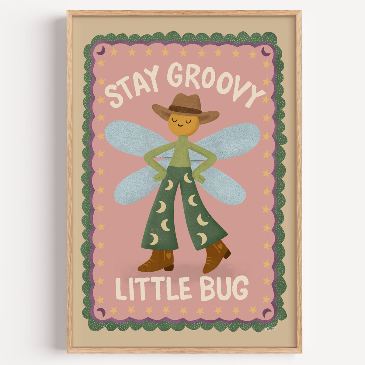 Stay groovy little bug cowboy nursery print in a light oak frame on a plain white wall