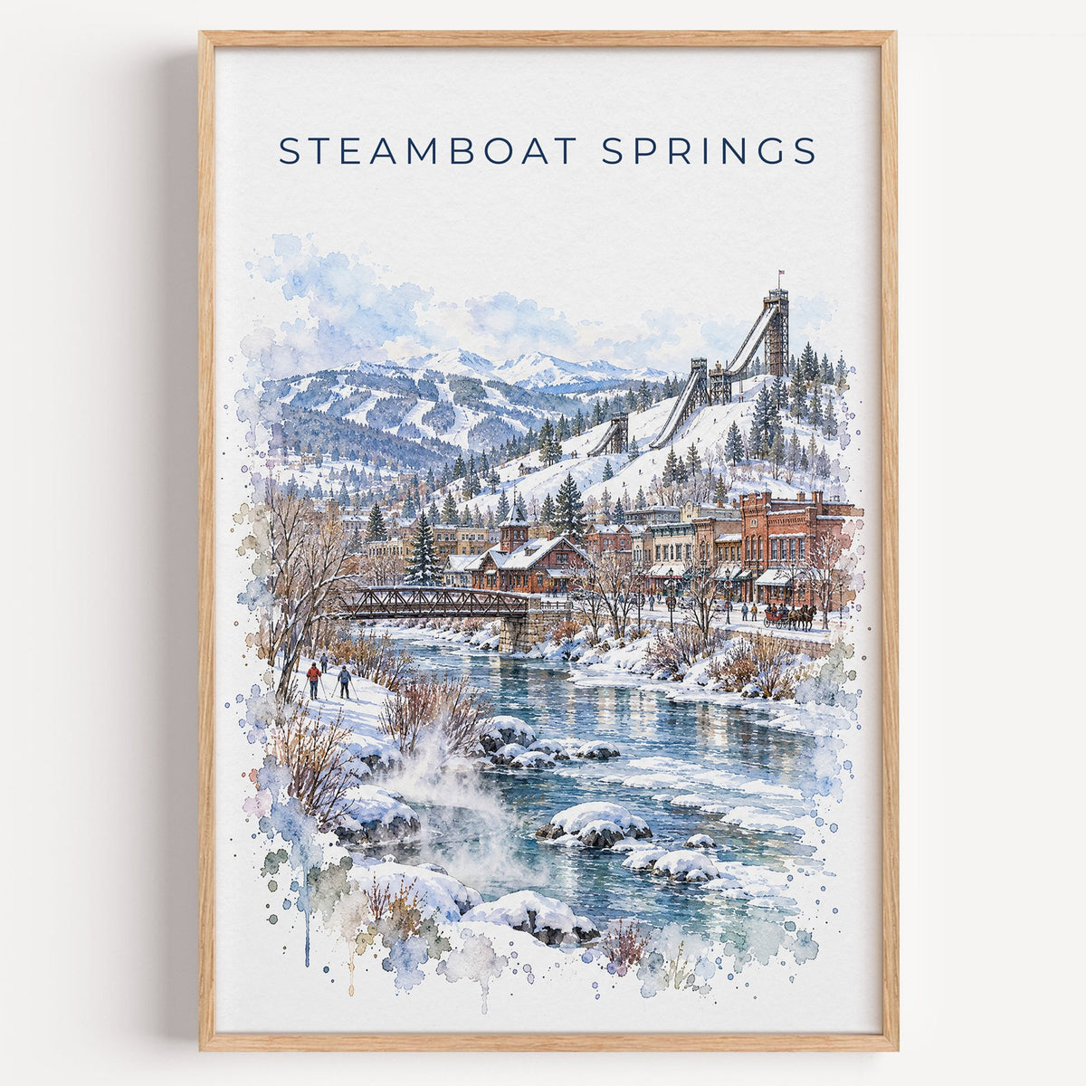 Steamboat Springs watercolor print in a light oak frame on a plain white wall