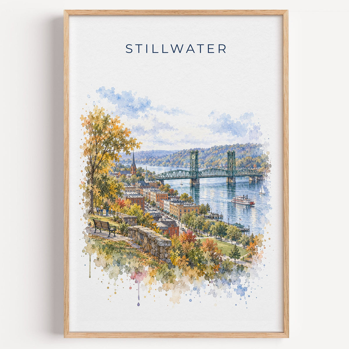 Stillwater, Minnesota watercolor print in a light oak frame on a plain white wall