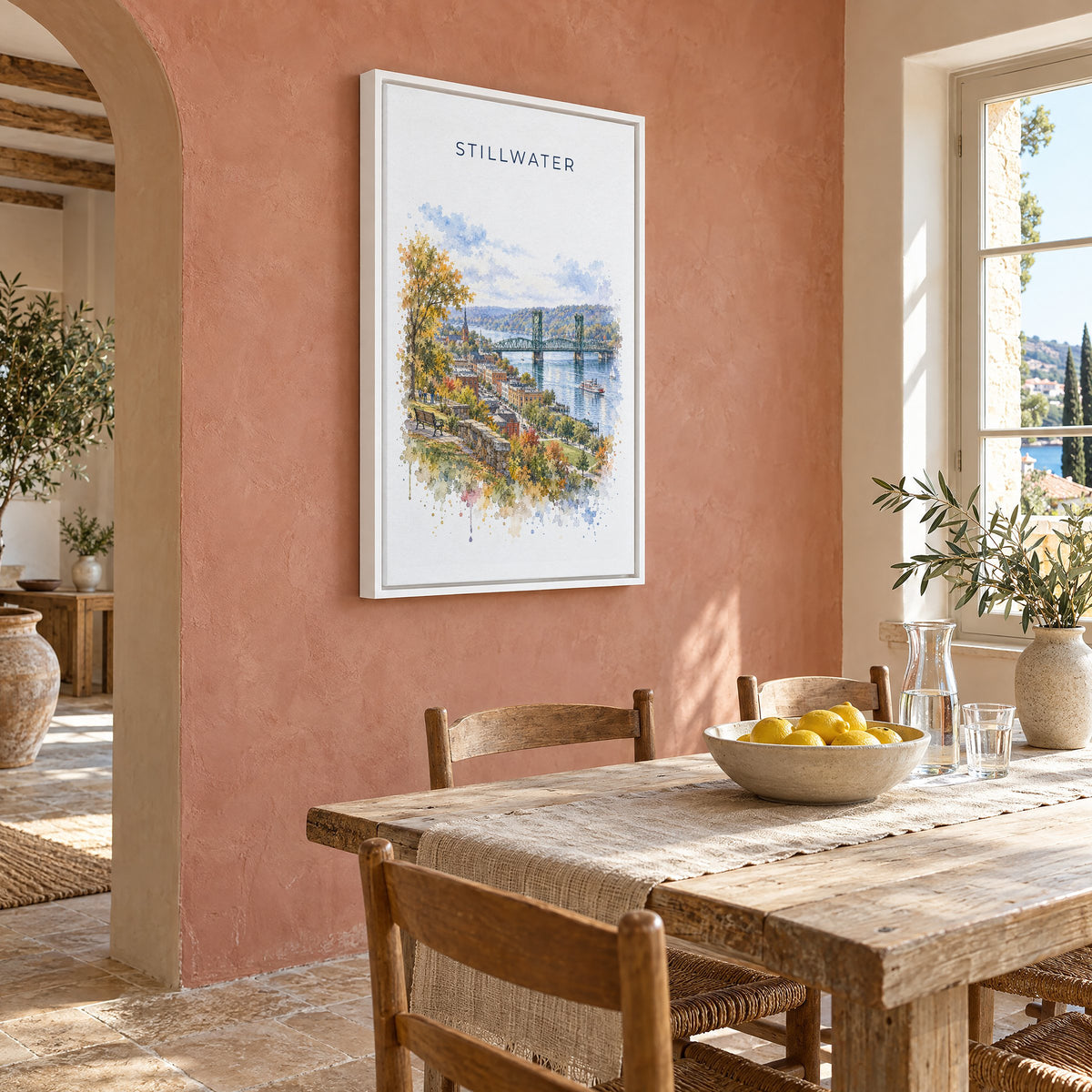 Stillwater, Minnesota watercolor print as a white floater canvas on a terracotta wall above a rustic dining table