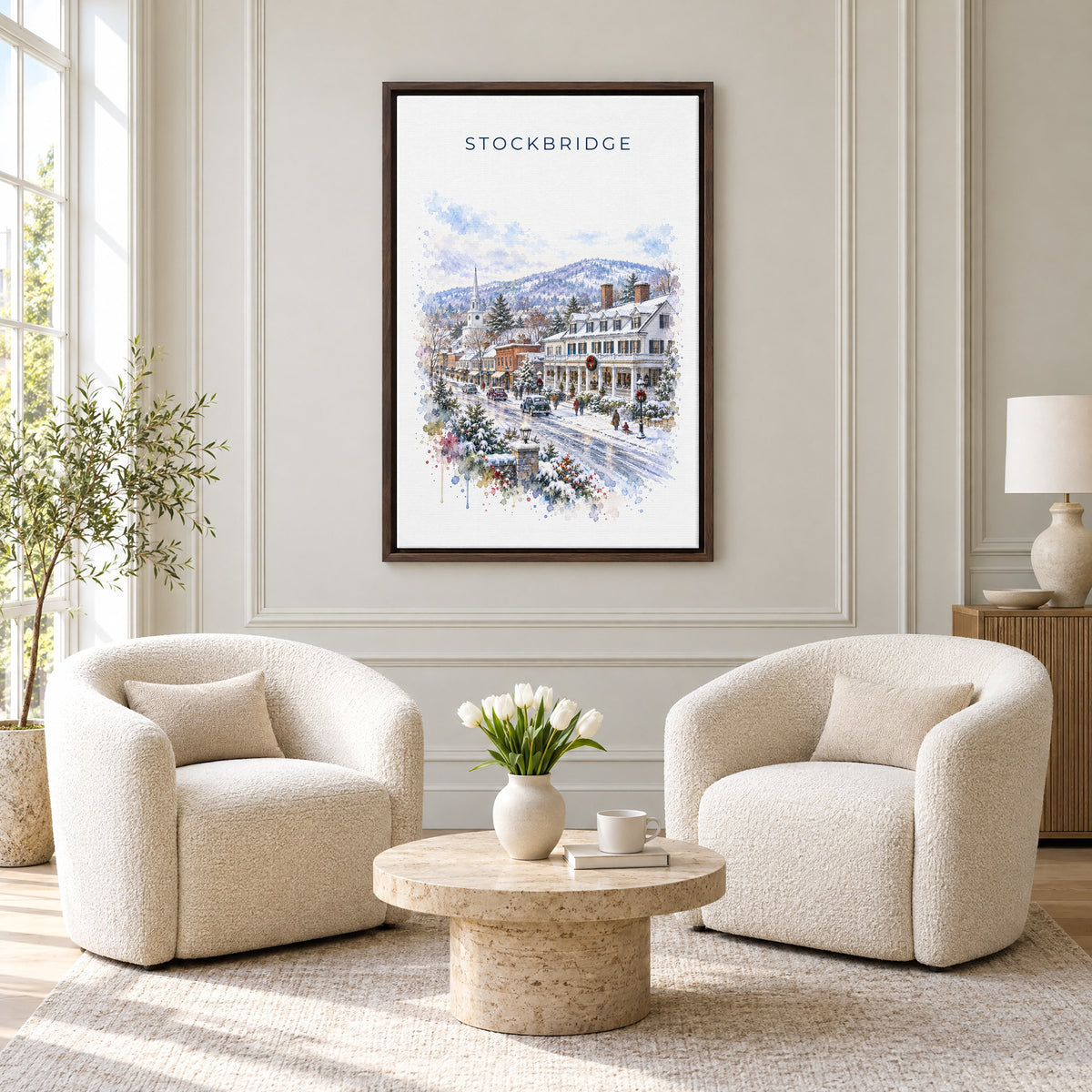 Stockbridge, Massachusetts watercolor print as an espresso floater canvas above two boucle armchairs in a hotel lounge