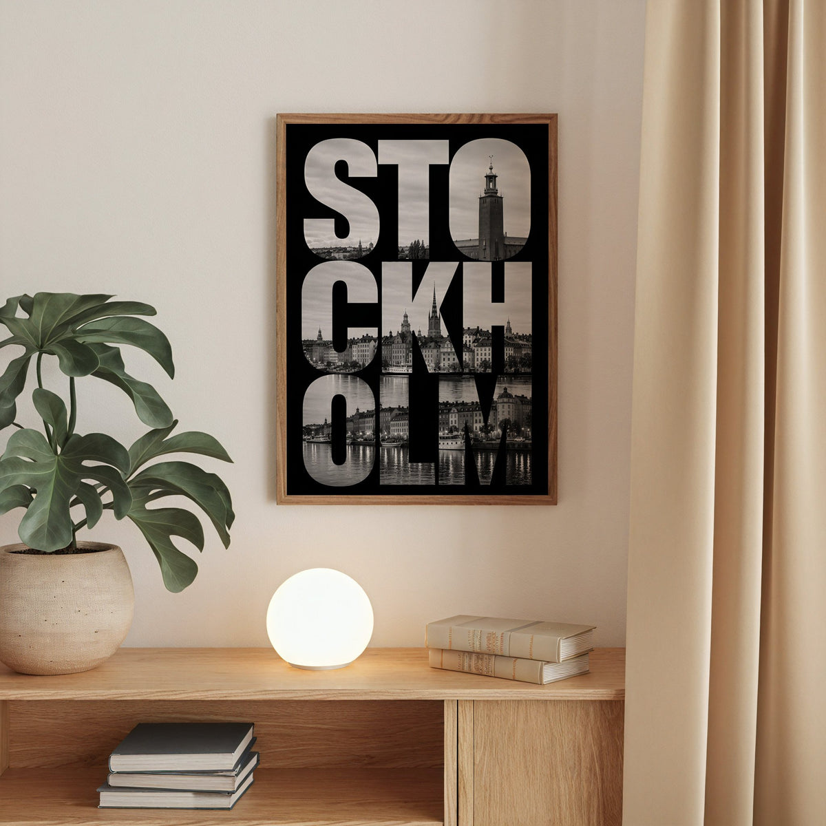 Stockholm letters filled with city photo print in a walnut frame above an oak cabinet with a glowing globe lamp