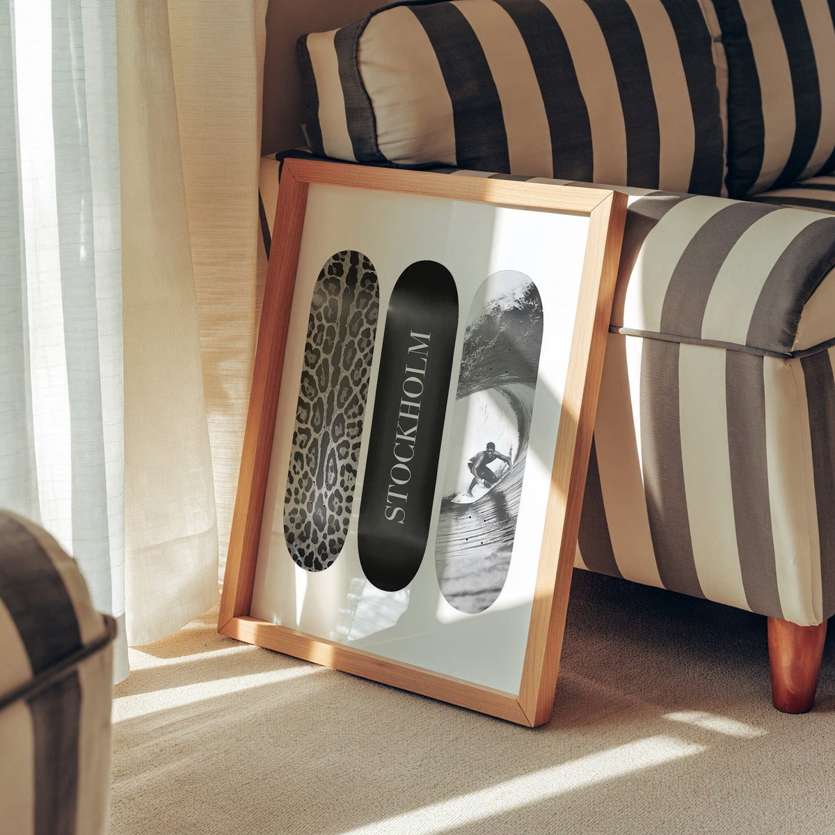 Three skateboards with leopard spots, Stockholm deck, surfer in a pine frame leaning against a striped armchair