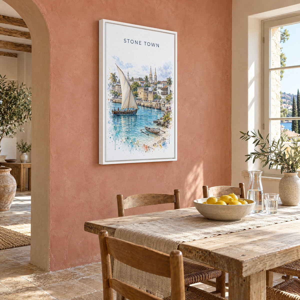 Stone Town watercolor print as a white floater canvas on a terracotta wall above a rustic dining table