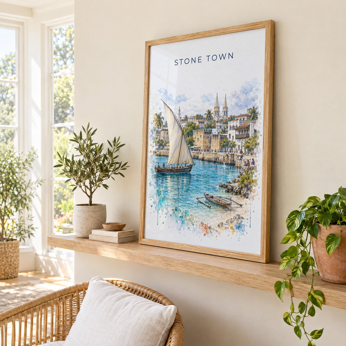 Stone Town watercolor print in an oak frame on a picture ledge in a sunlit sunroom