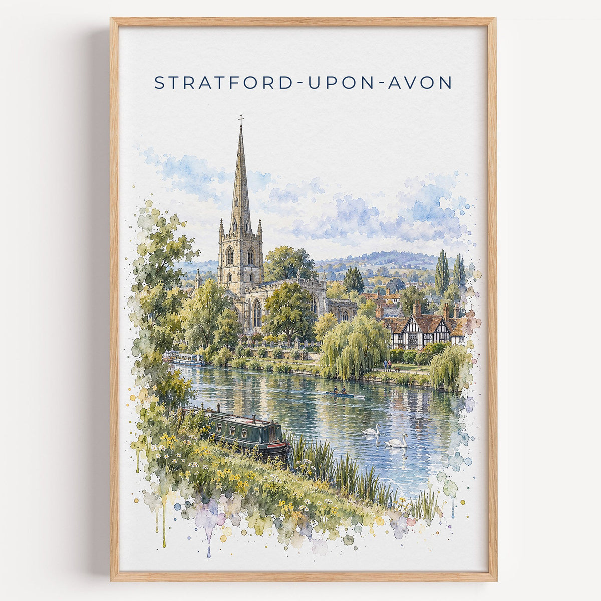 Stratford-upon-Avon watercolor print in a light oak frame on a plain white wall