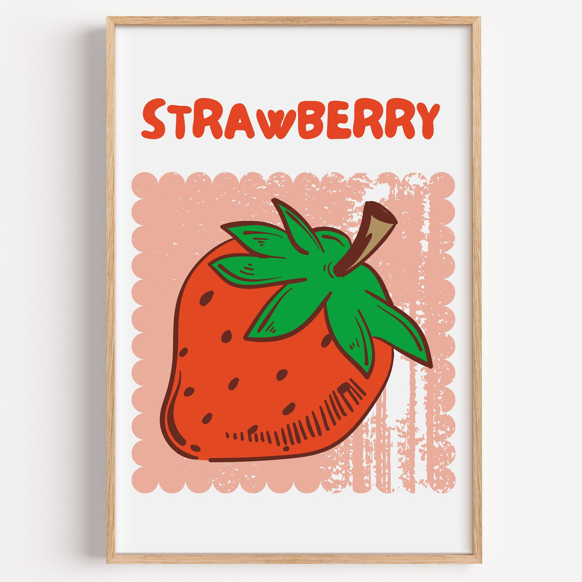 Strawberry scallop frame print in a light oak frame on a plain white wall
