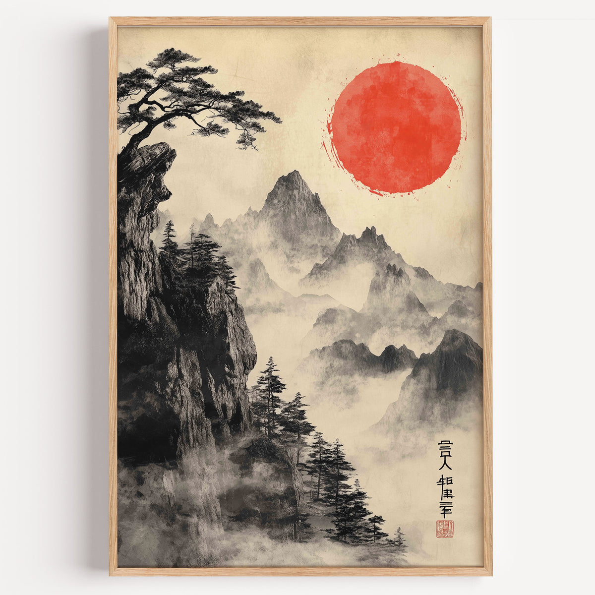 Sumi-e misty mountains and red sun print in a light oak frame on a plain white wall