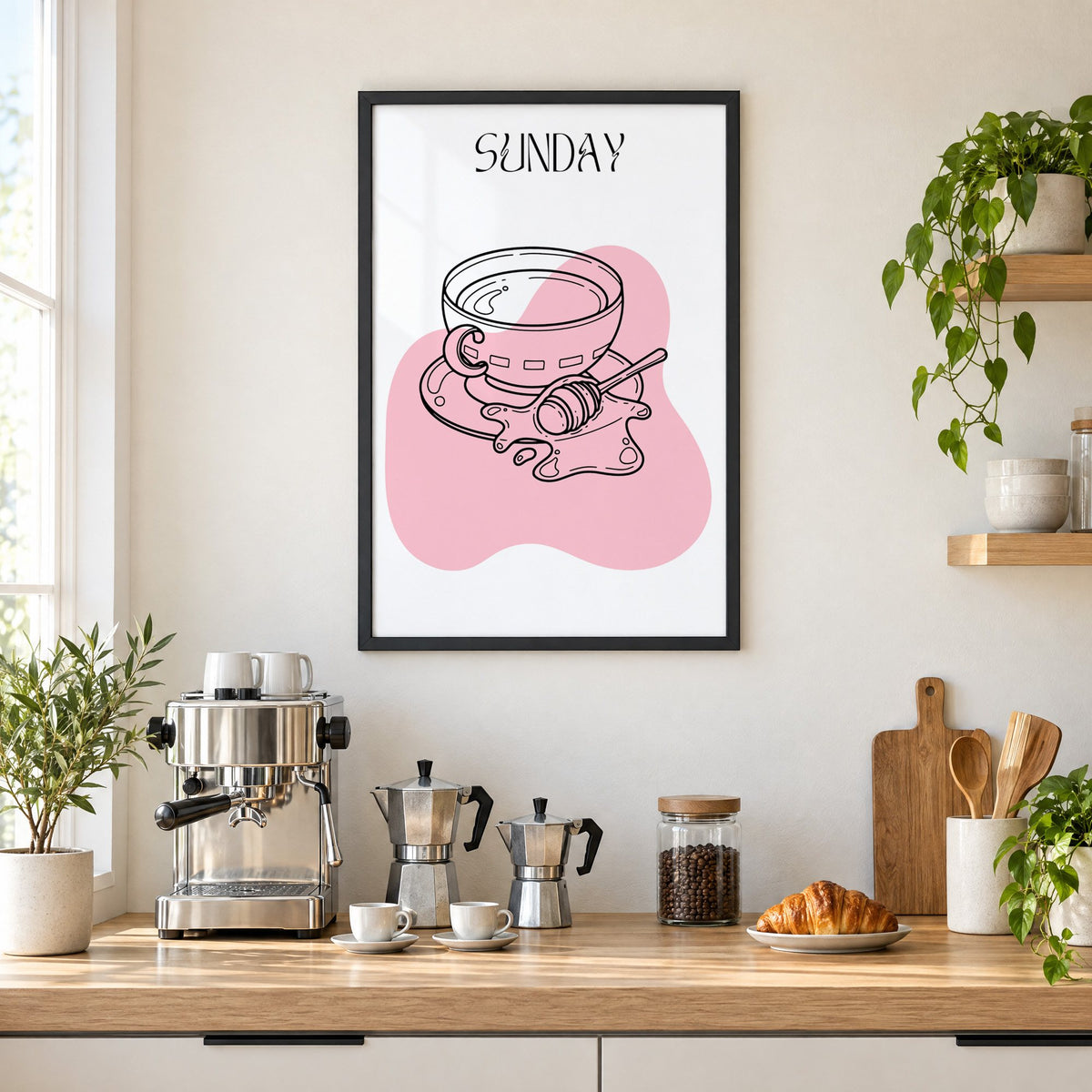 SUNDAY teacup and honey dipper line print in a black frame above a home espresso bar with moka pots and espresso cups