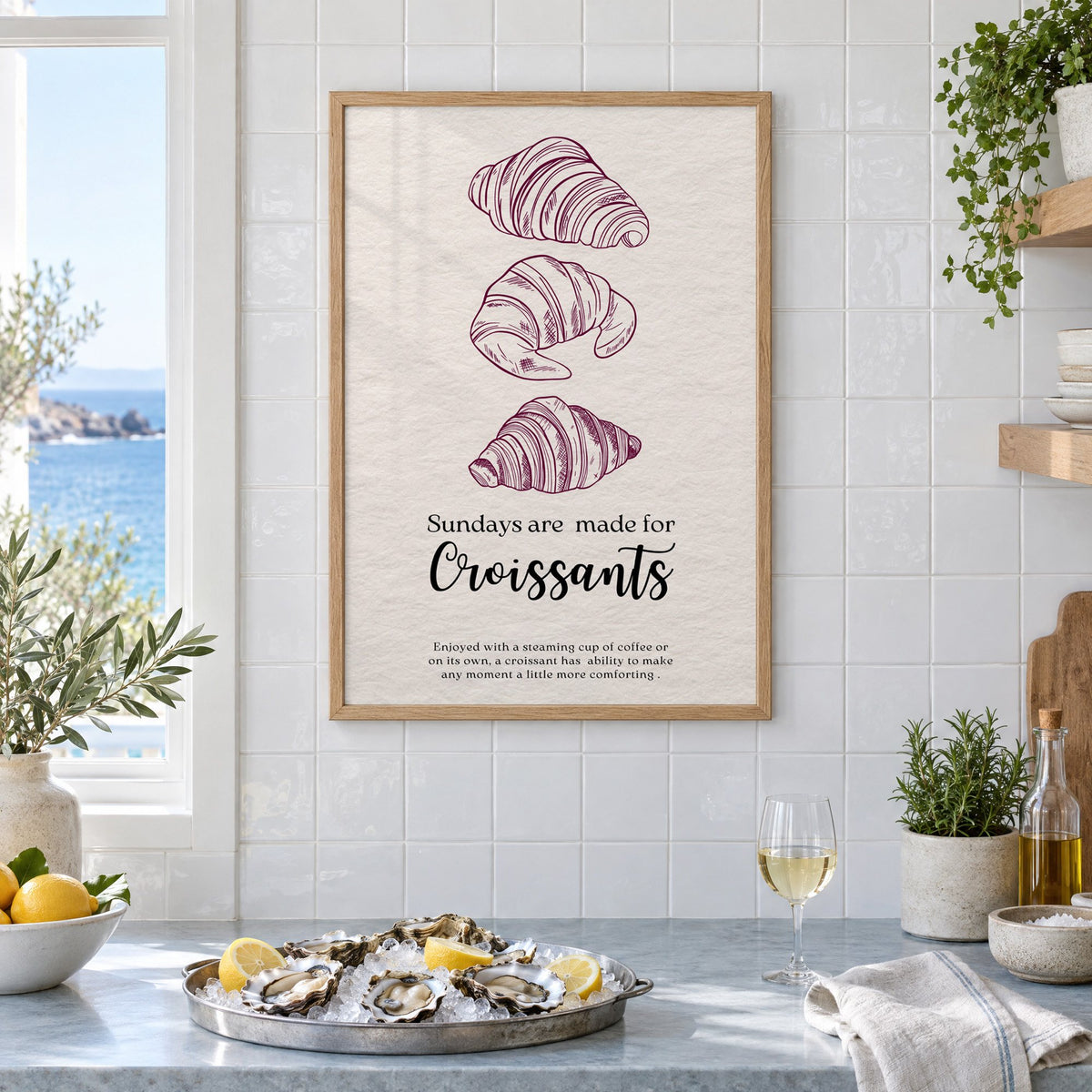 Sundays are made for Croissants burgundy engraving print in an oak frame on white tiles above a marble counter with oysters and lemons by a sea view