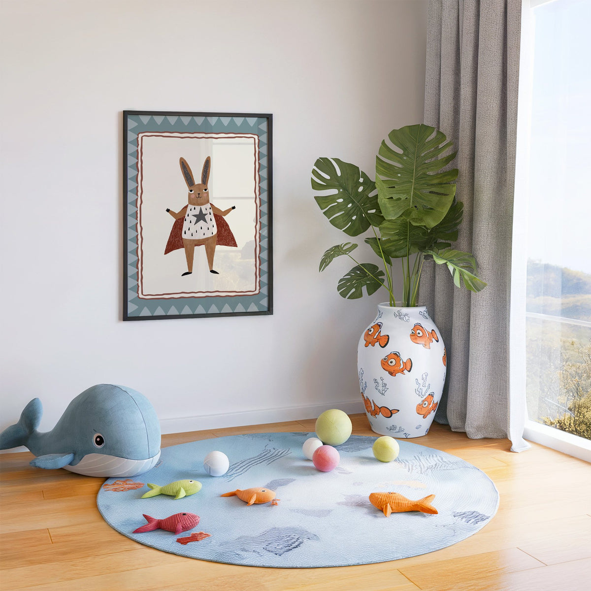 Superhero bunny in red cape nursery print in a black frame in a playroom with an ocean rug and whale plush
