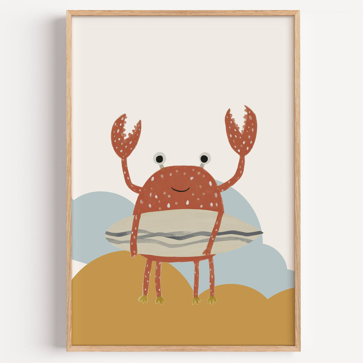 Surfing crab mustard hills nursery print in a light oak frame on a plain white wall