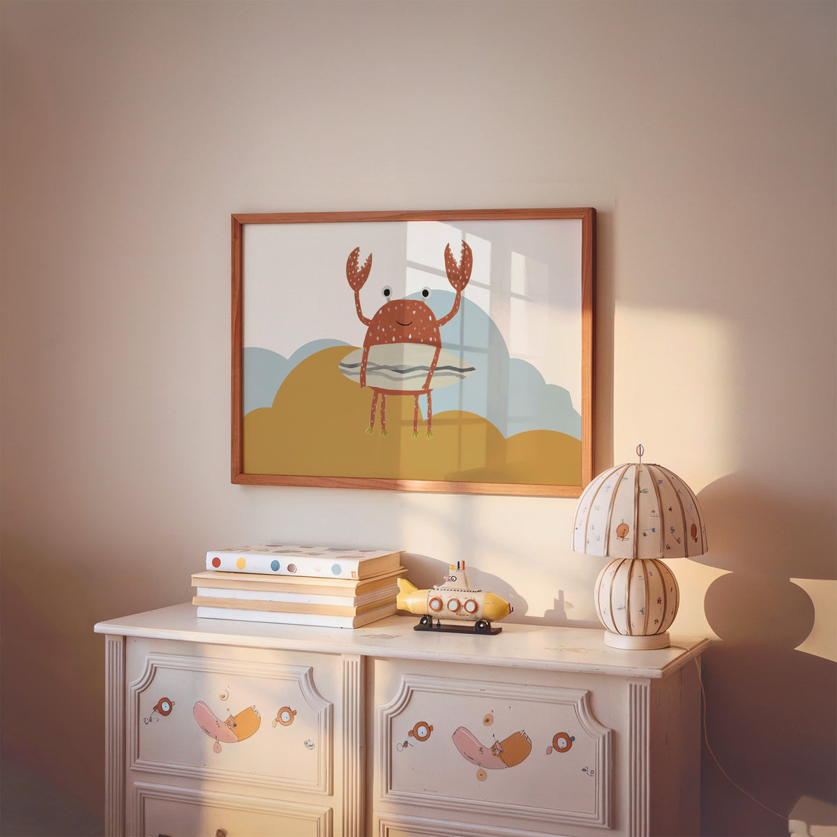 Landscape surfing crab mustard hills nursery print in a cherry wood frame above a painted dresser and lamp