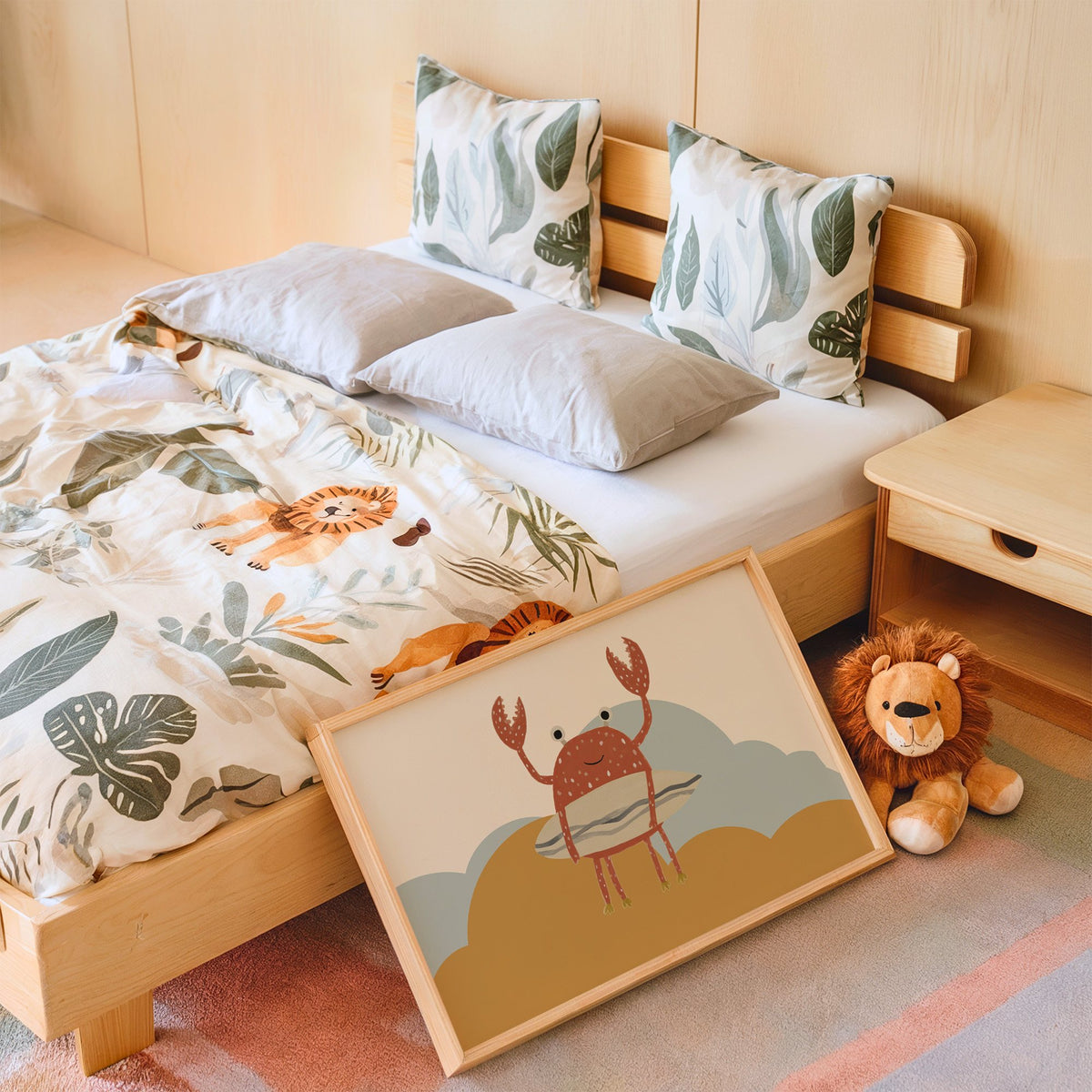 Landscape surfing crab mustard hills nursery print in an oak frame leaning on a kids bed by a lion plush